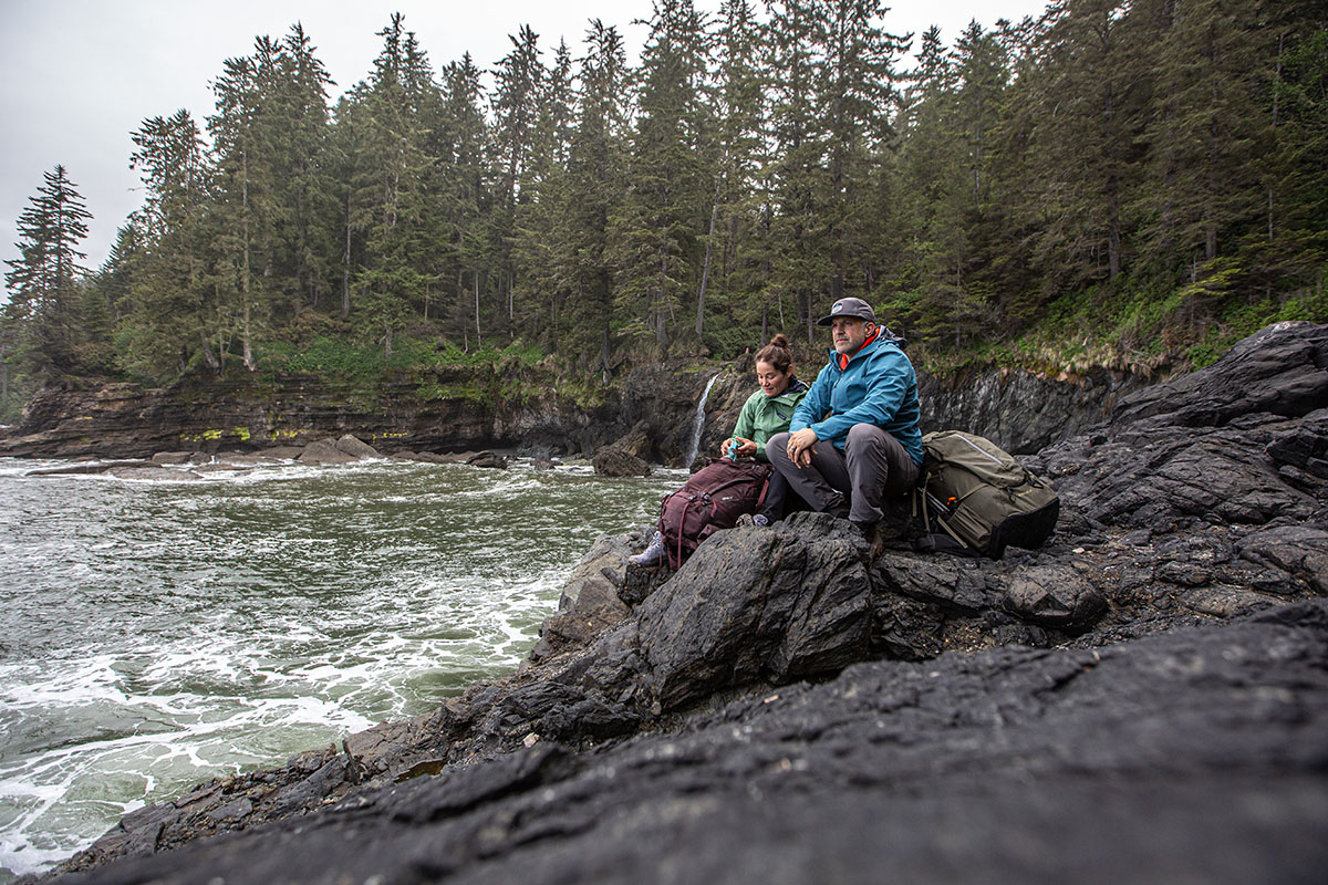 Arc'teryx Ralle Jacket (sitting on rocks by water)